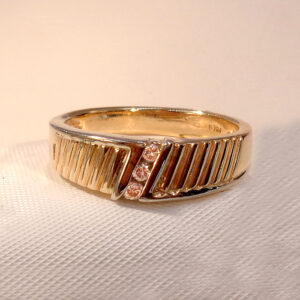14K yellow gold 7mm tapered wedding band with diamonds