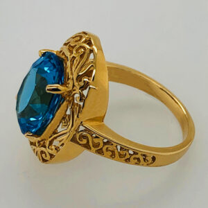 14Karat yellow gold antique fashioned filigree design ring with 8.00ct Oval shaped Blue topaz stone.