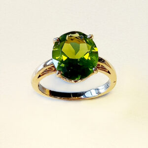 Oval 12x 10 Fine quality Peridot set in a beautiful floral basket setting.